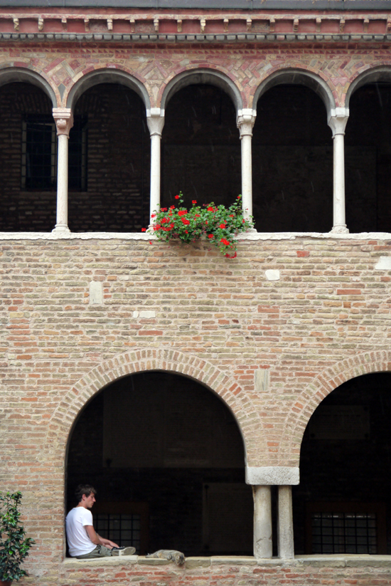 Bologna, Santo Stephano basilica, youngster with cat
