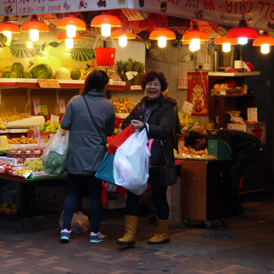 Hong Kong, Wan Chai, Laughing woman at market